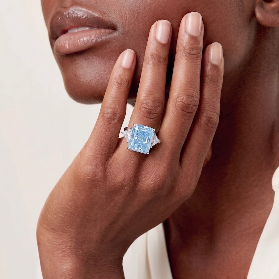 big diamond ring in gold on girl finger