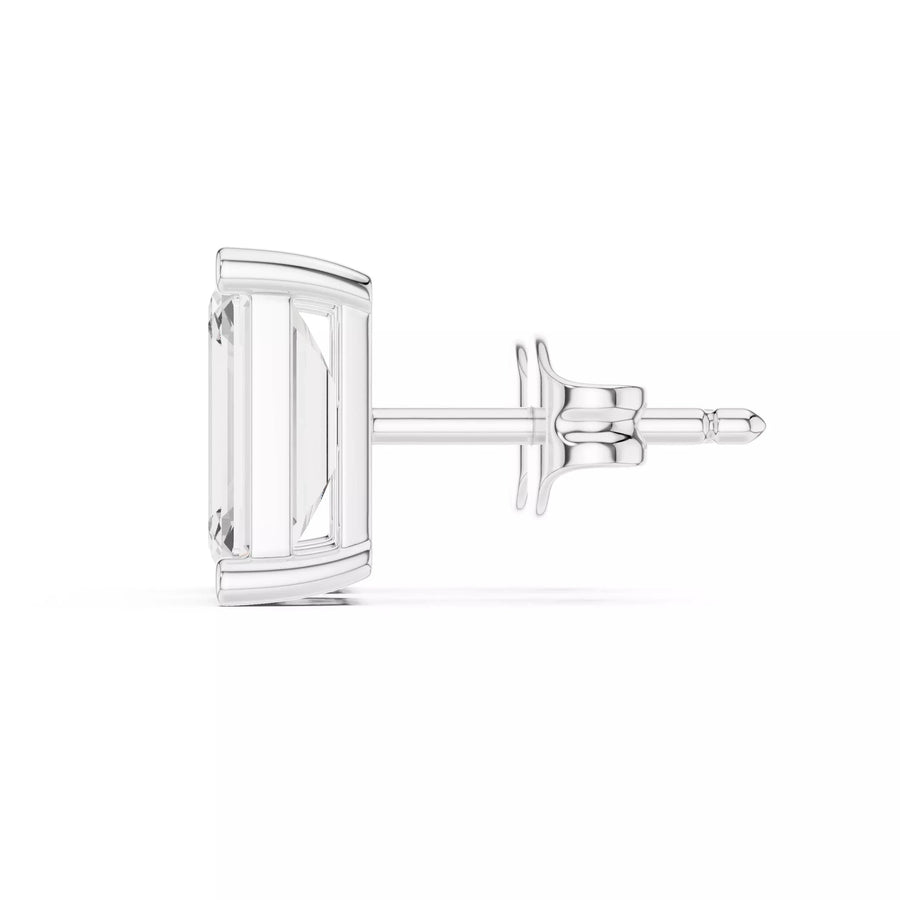 emerald cut diamond earrings on the white background side view