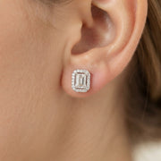 Emerald cut diamond stud earring on a girl earlobe,14k white gold