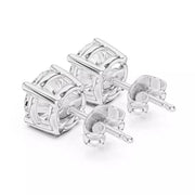 A pair of gold stud earrings with a geometric, openwork frame design, shown from the back on a clean white background.
