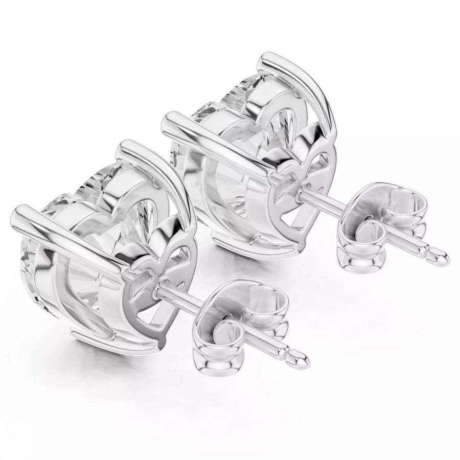 Heart shape diamond stud earrings on white background
