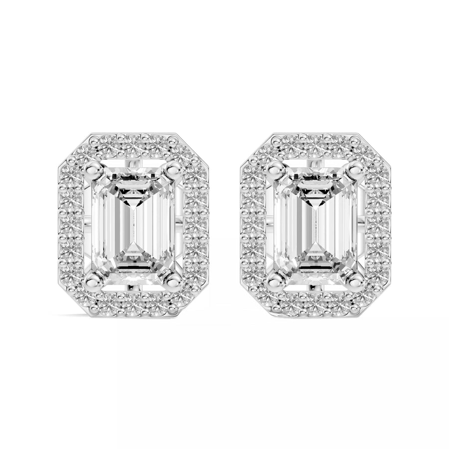 A pair of emerald-cut halo stud earrings in 14k white gold, featuring a large clear central stone surrounded by a halo of smaller clear stones, set against a plain white background.
